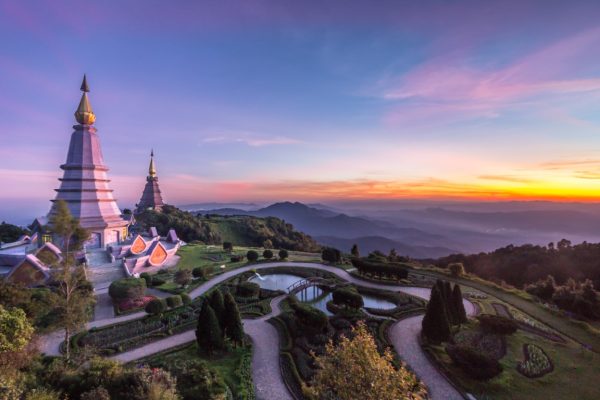 two famous pagoda at colorful pink sunset. Doi Inthanon national park, Thailand